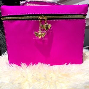 Pink Estée Lauder makeup bag